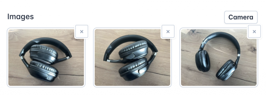 An 'Images' section displaying three pictures of black over-ear headphones placed on a wooden surface. Each image has a small 'X' button in the top-right corner for removal. A 'Camera' button is positioned in the top-right corner of the section, allowing users to capture and add new images.